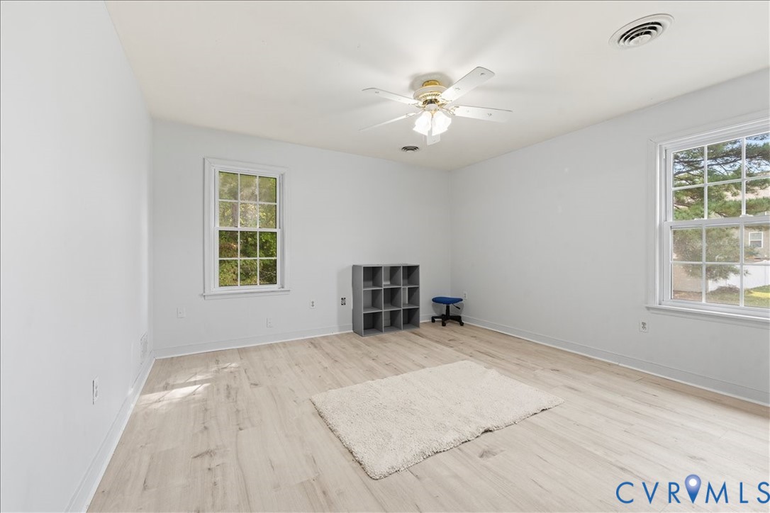7141 Barkbridge Road Chesterfield, VA 23832 - Photo 29 of 44 Empty room with light wood-style floors and ceilin