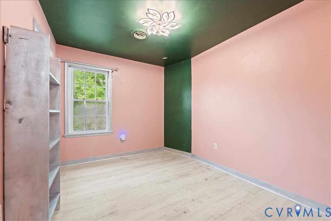7141 Barkbridge Road Chesterfield, VA 23832 - Photo 33 of 44 Empty room featuring wood finished floors and base