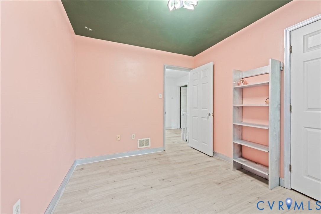 7141 Barkbridge Road Chesterfield, VA 23832 - Photo 34 of 44 Spare room with light wood-style flooring and base