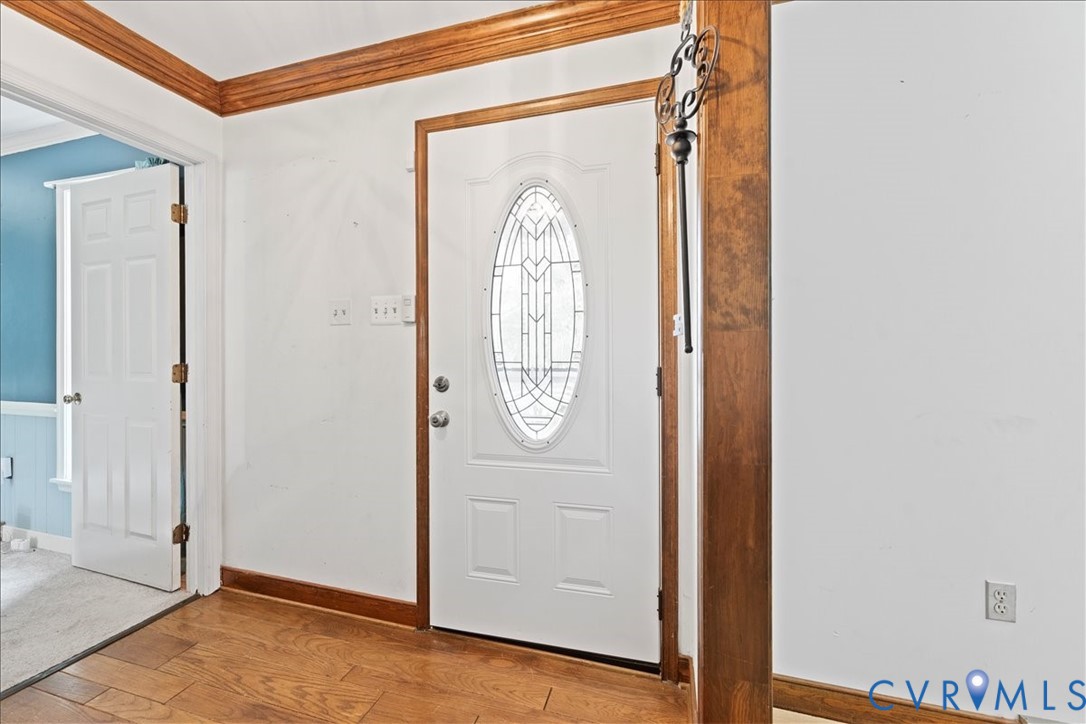 7141 Barkbridge Road Chesterfield, VA 23832 - Photo 8 of 44 Entryway with wood finished floors and crown moldi