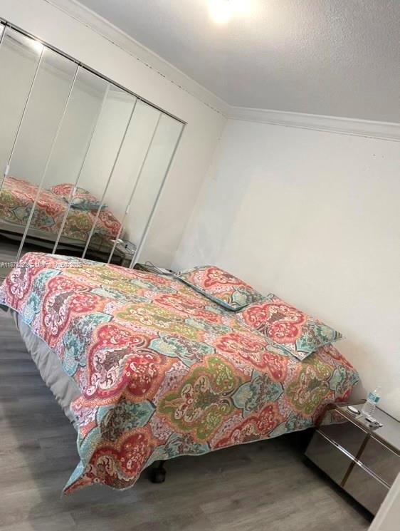 23304 Southwest 58th Avenue, Unit B Boca Raton, FL 33428 - Photo 21 of 32 a bedroom with a bed and a mirror