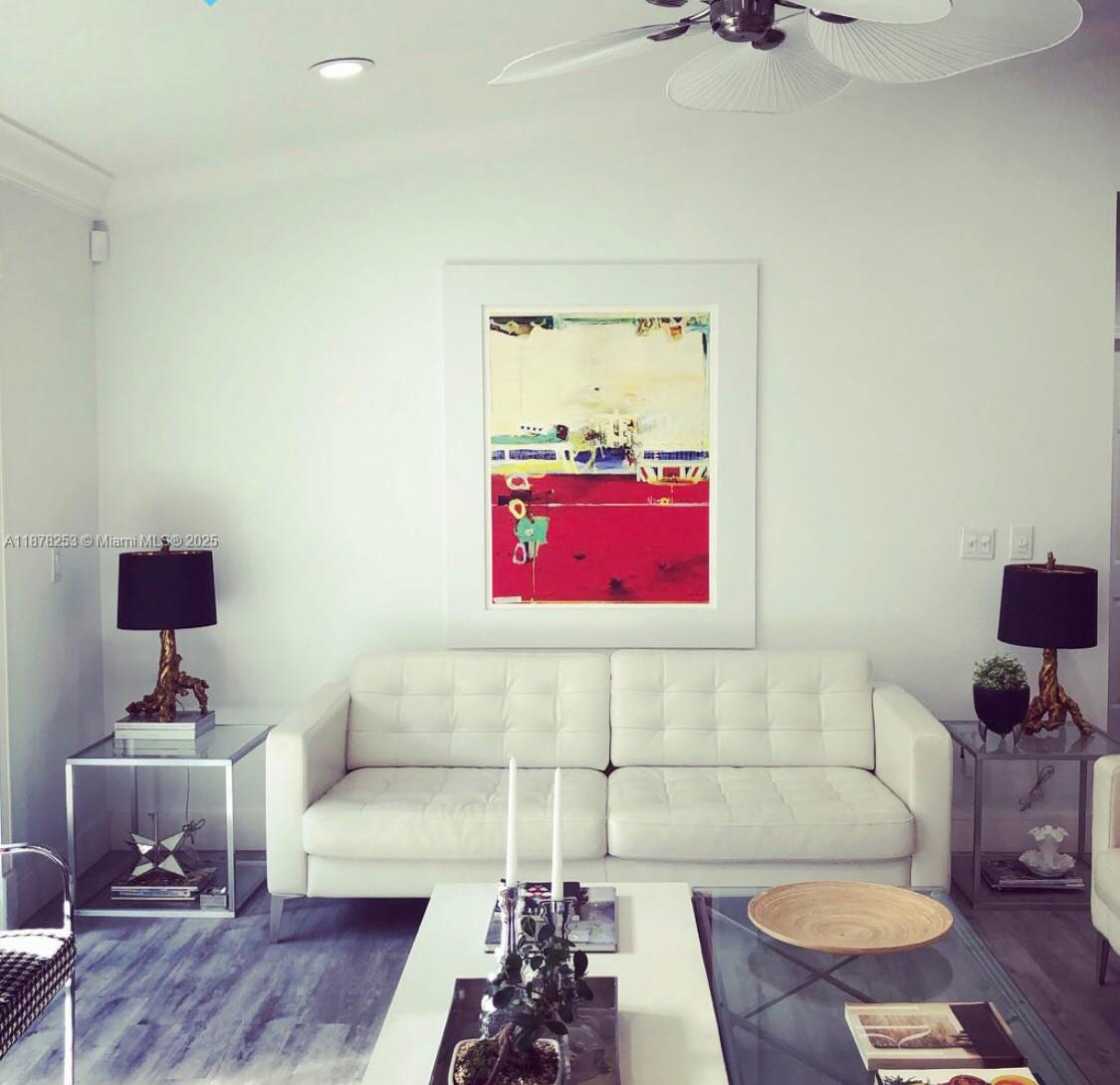 23304 Southwest 58th Avenue, Unit B Boca Raton, FL 33428 - Photo 8 of 32 a living room with furniture and a wooden floor