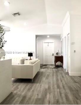 23304 Southwest 58th Avenue, Unit B Boca Raton, FL 33428 - Photo 9 of 32 a living room with furniture and a window