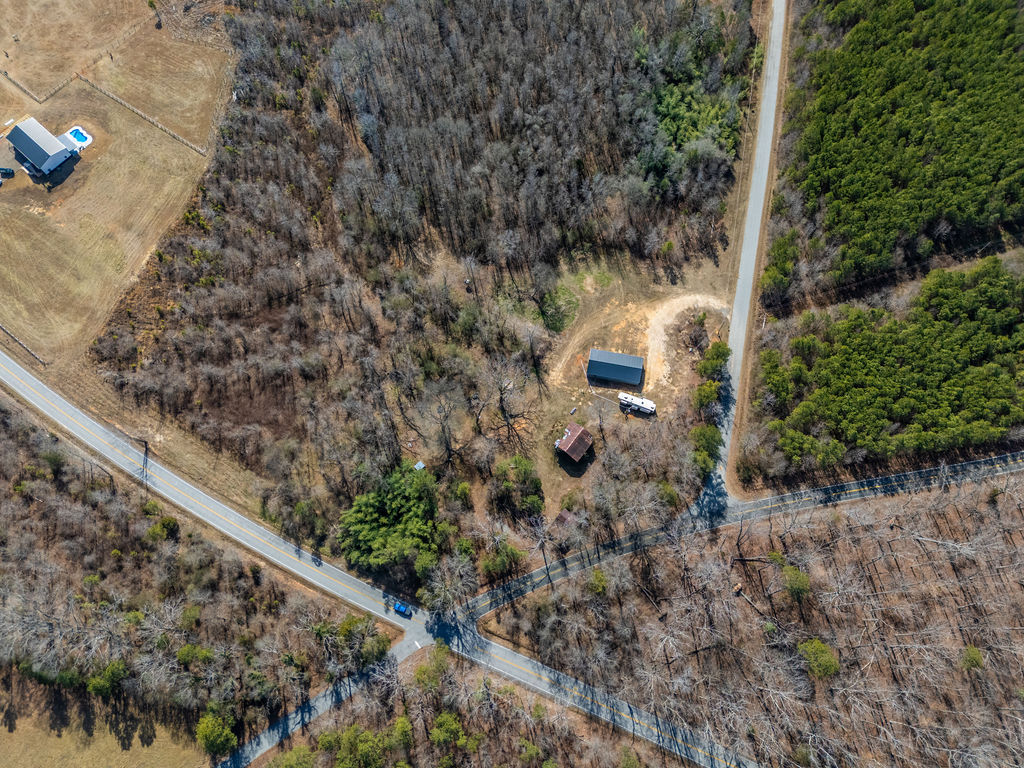 900 Asaville School Road Anderson, SC 29621 - Photo 21 of 29 This expansive aerial view showcases a property with a secluded home and lush wooded areas.