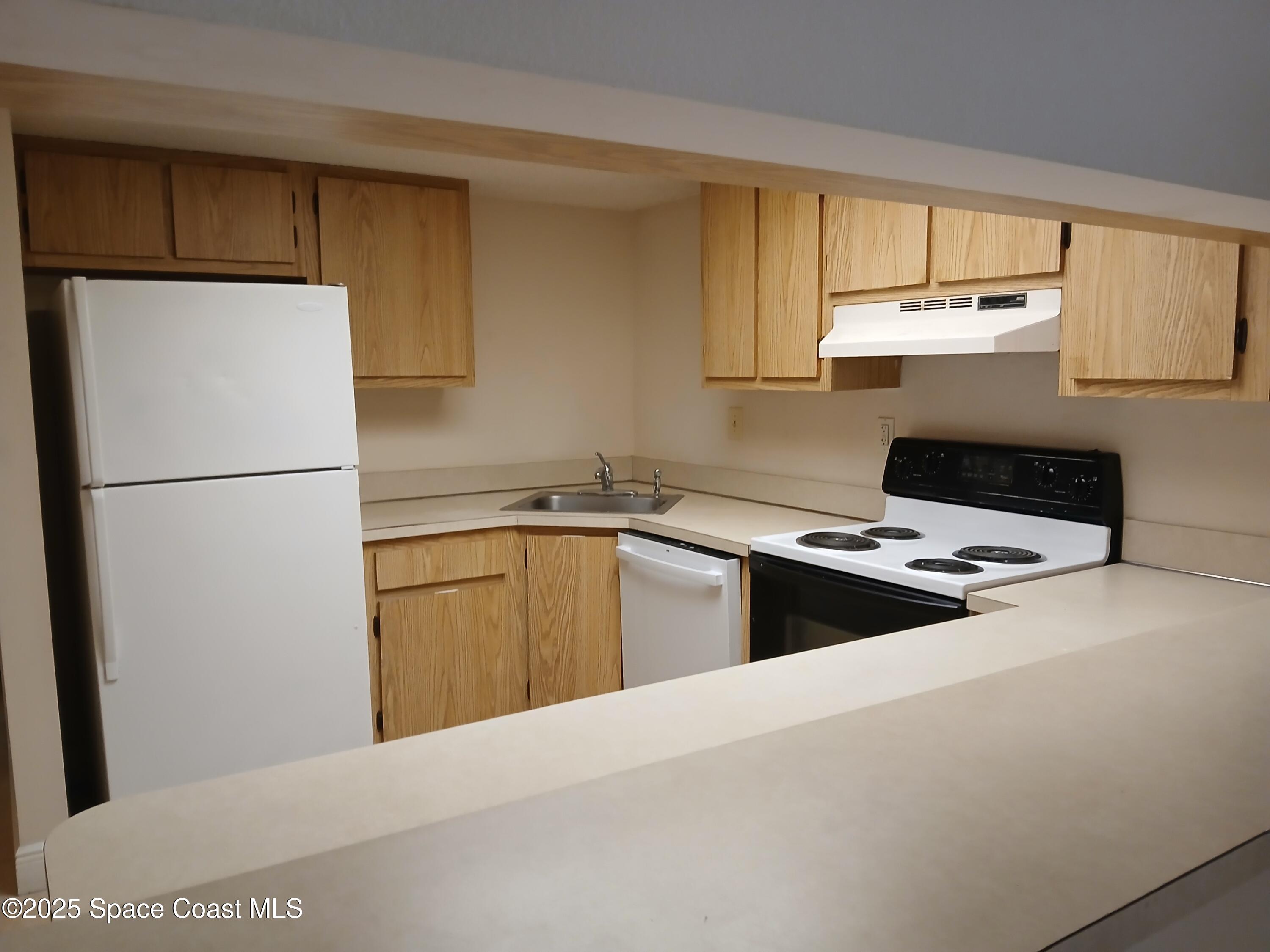 1641 Sunny Brook Lane, Unit C206 Palm Bay, FL 32905 - Photo 4 of 9 Kitchen View 1