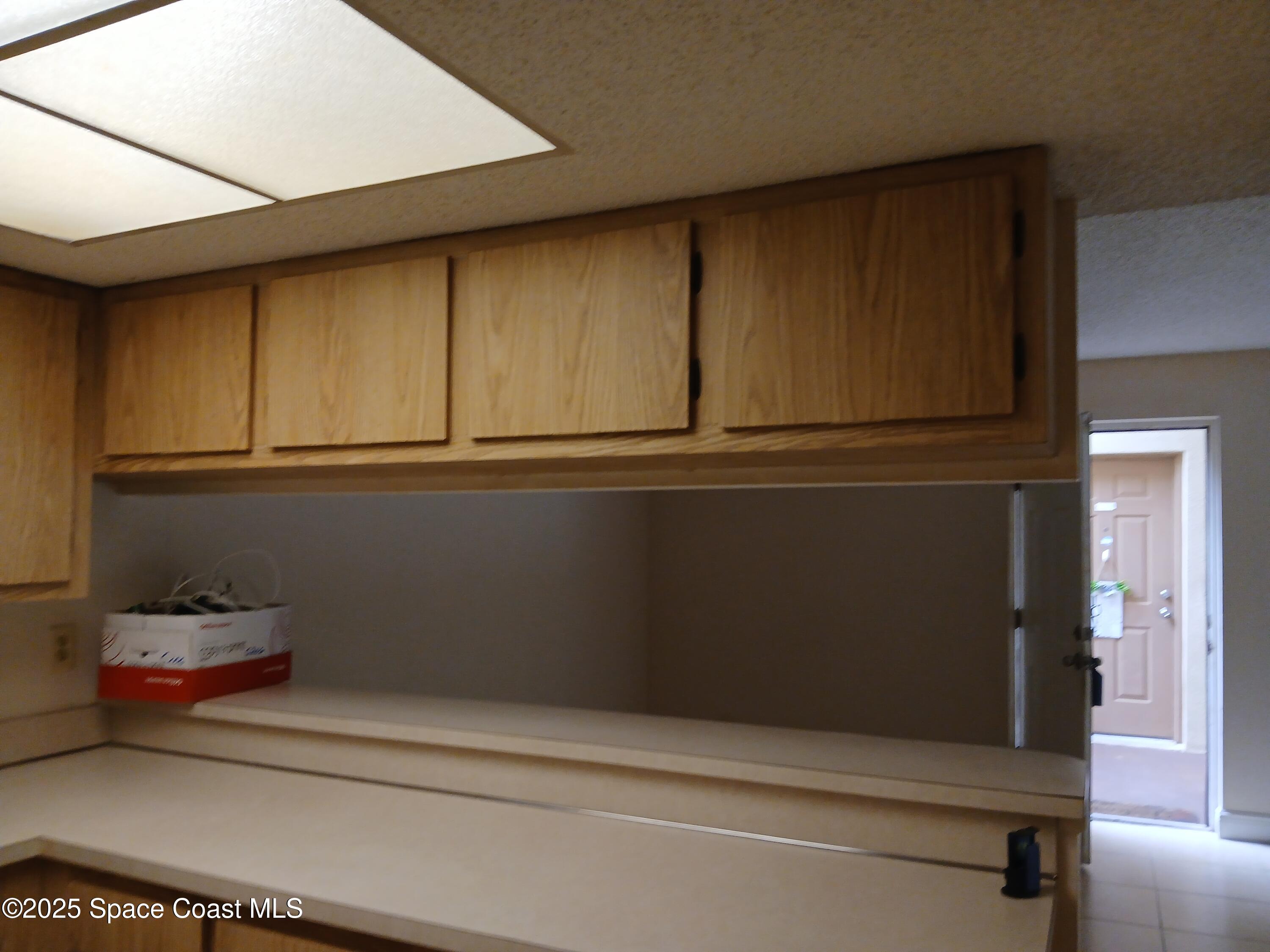 1641 Sunny Brook Lane, Unit C206 Palm Bay, FL 32905 - Photo 5 of 9 Kitchen View 2