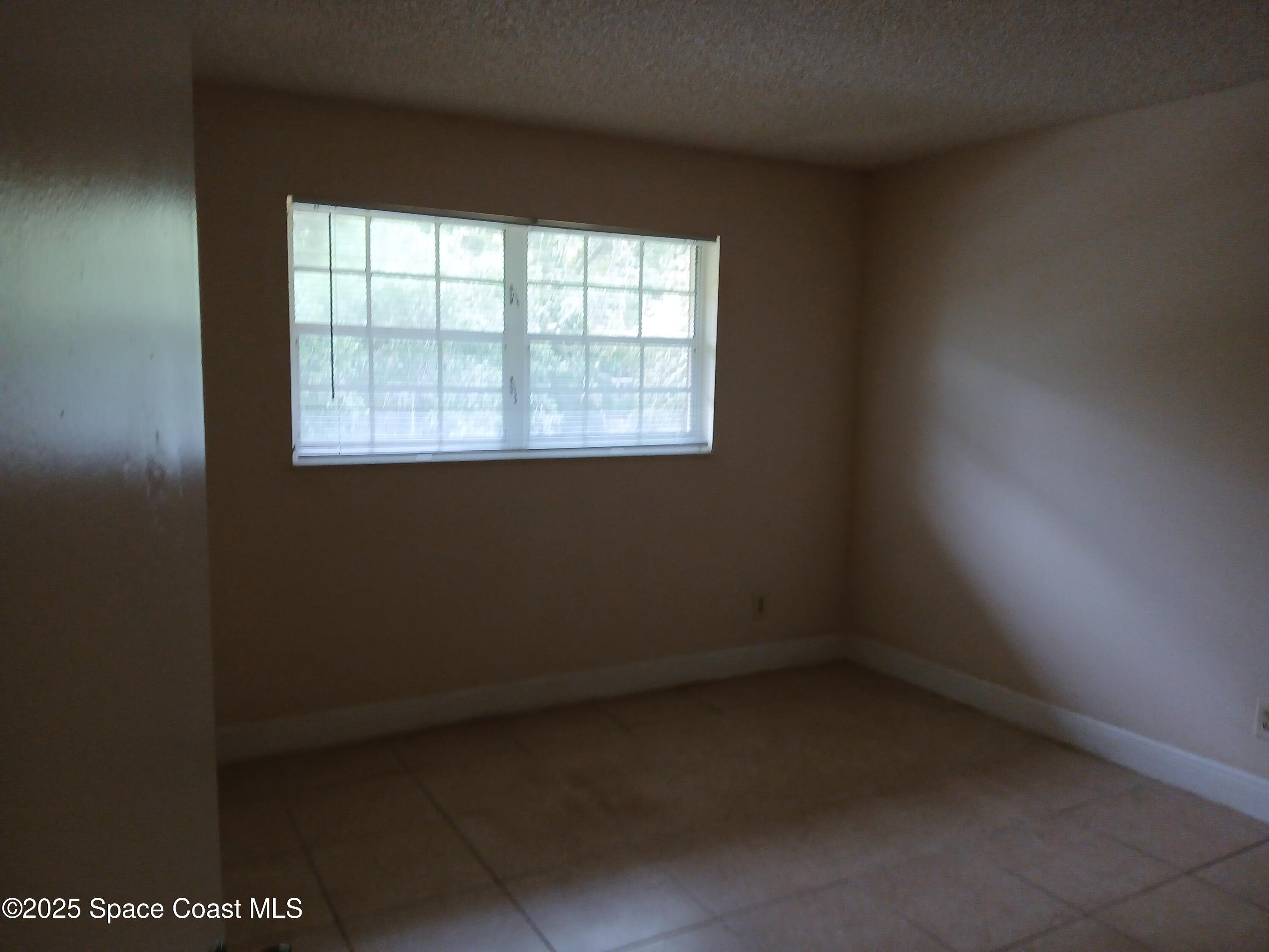 1641 Sunny Brook Lane, Unit C206 Palm Bay, FL 32905 - Photo 6 of 9 Master Bedroom