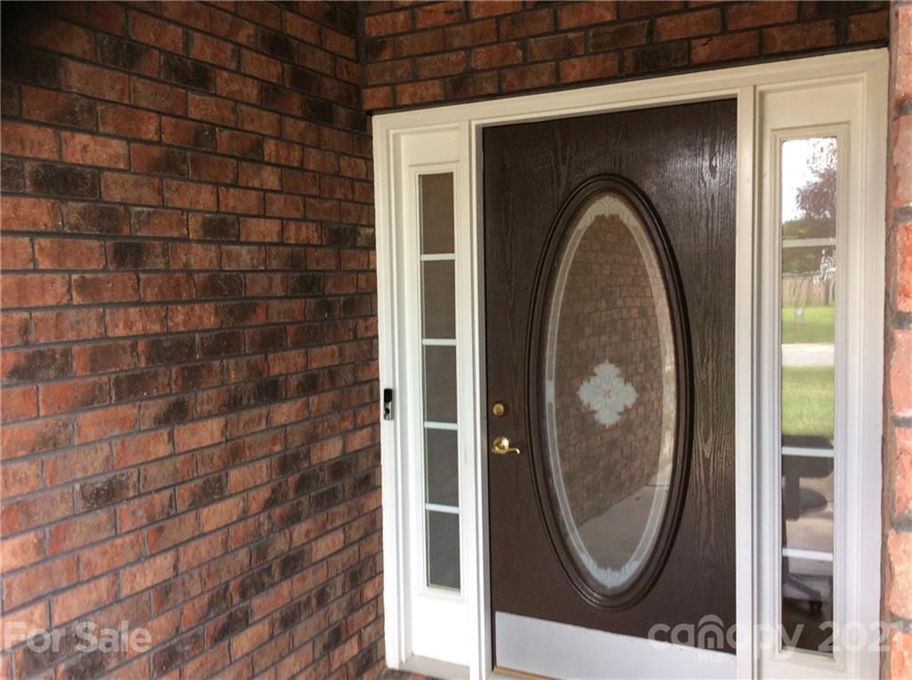 121 Newport Drive Kannapolis, NC 28081 - Photo 2 of 22 a close view of a wooden door in a bathroom