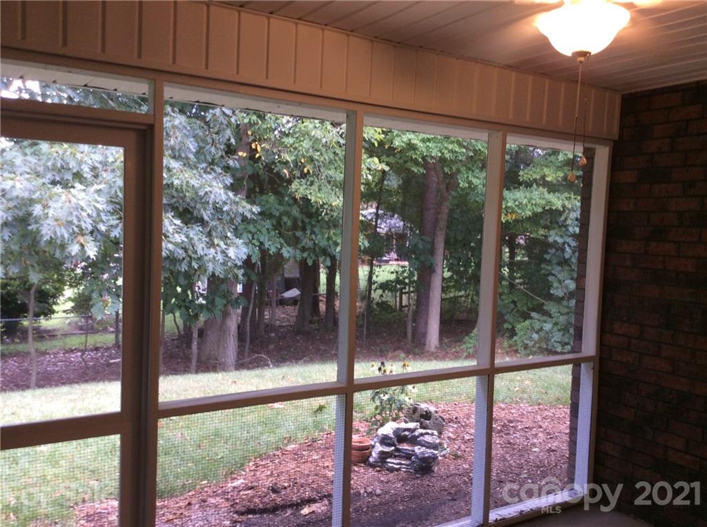121 Newport Drive Kannapolis, NC 28081 - Photo 17 of 22 a view of a room with a large window and wooden floor