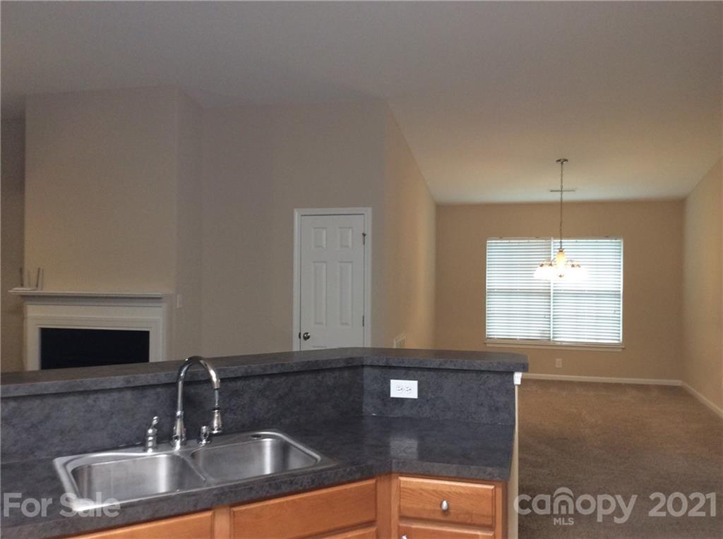121 Newport Drive Kannapolis, NC 28081 - Photo 21 of 22 a kitchen with a sink and a window