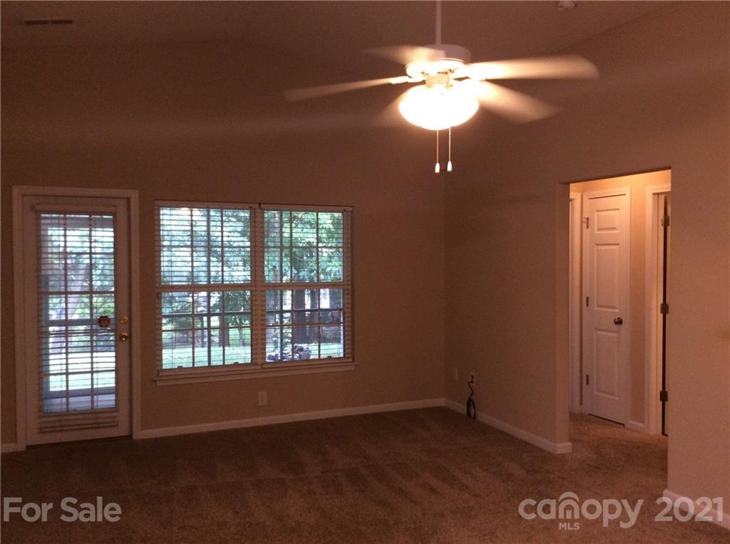 121 Newport Drive Kannapolis, NC 28081 - Photo 7 of 22 a view of an empty room with a window