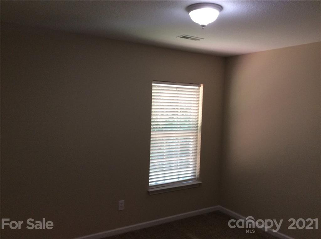 121 Newport Drive Kannapolis, NC 28081 - Photo 10 of 22 a view of an empty room with a window