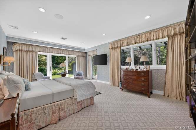 343 Chicken Valley Road Glen Head, NY 11545 - Photo 24 of 49 a bed room with a bed and a large window