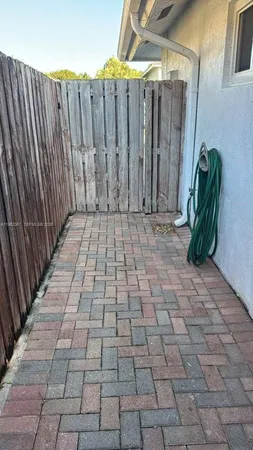 a view of a backyard with pathway