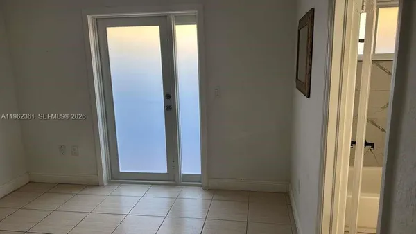 a view of an empty room with window