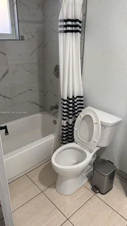 a bathroom with a toilet and a sink