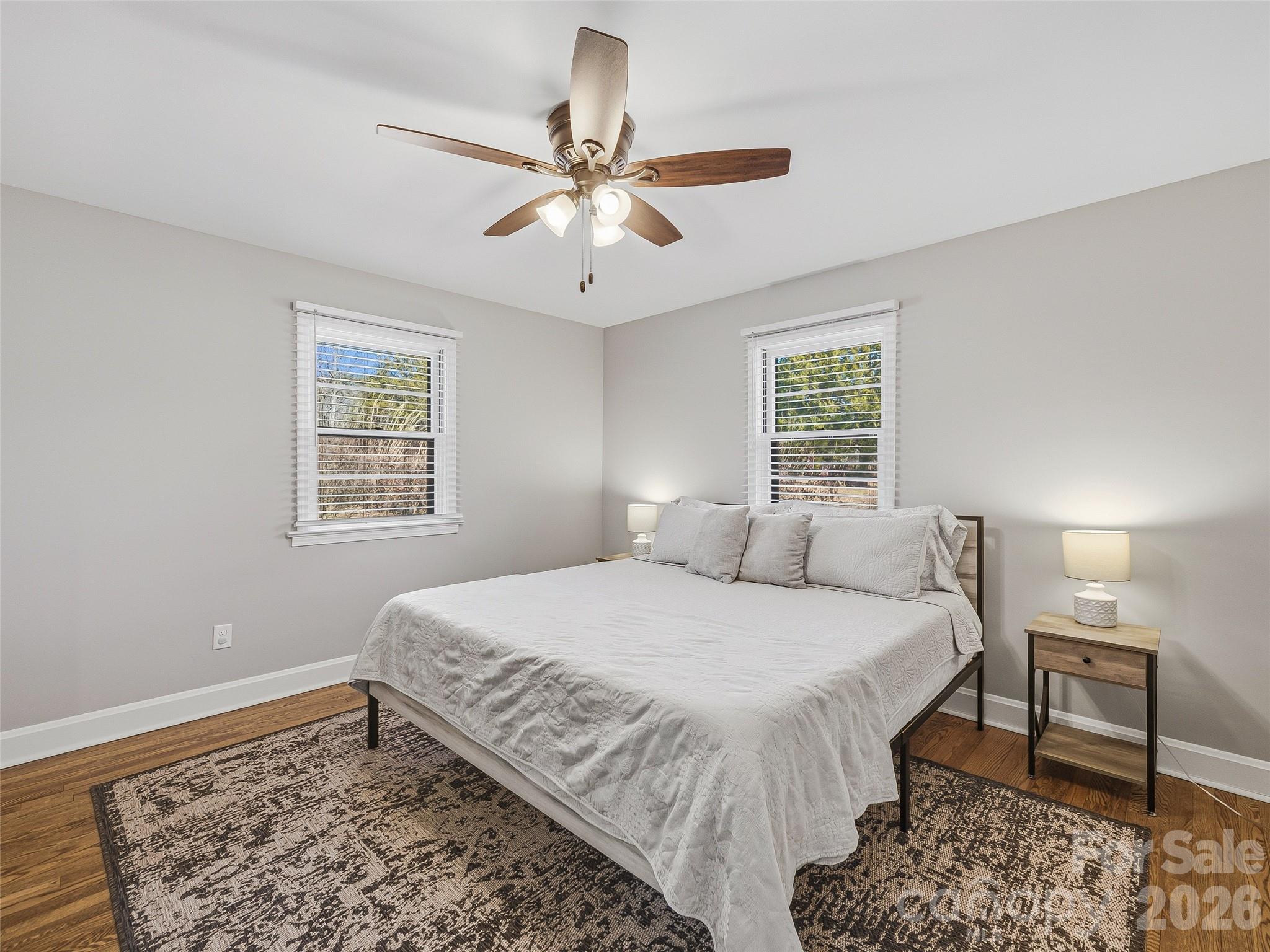 3869 Crab Creek Road Penrose, NC 28766 - Photo 11 of 19 a bedroom with a bed and a chandelier