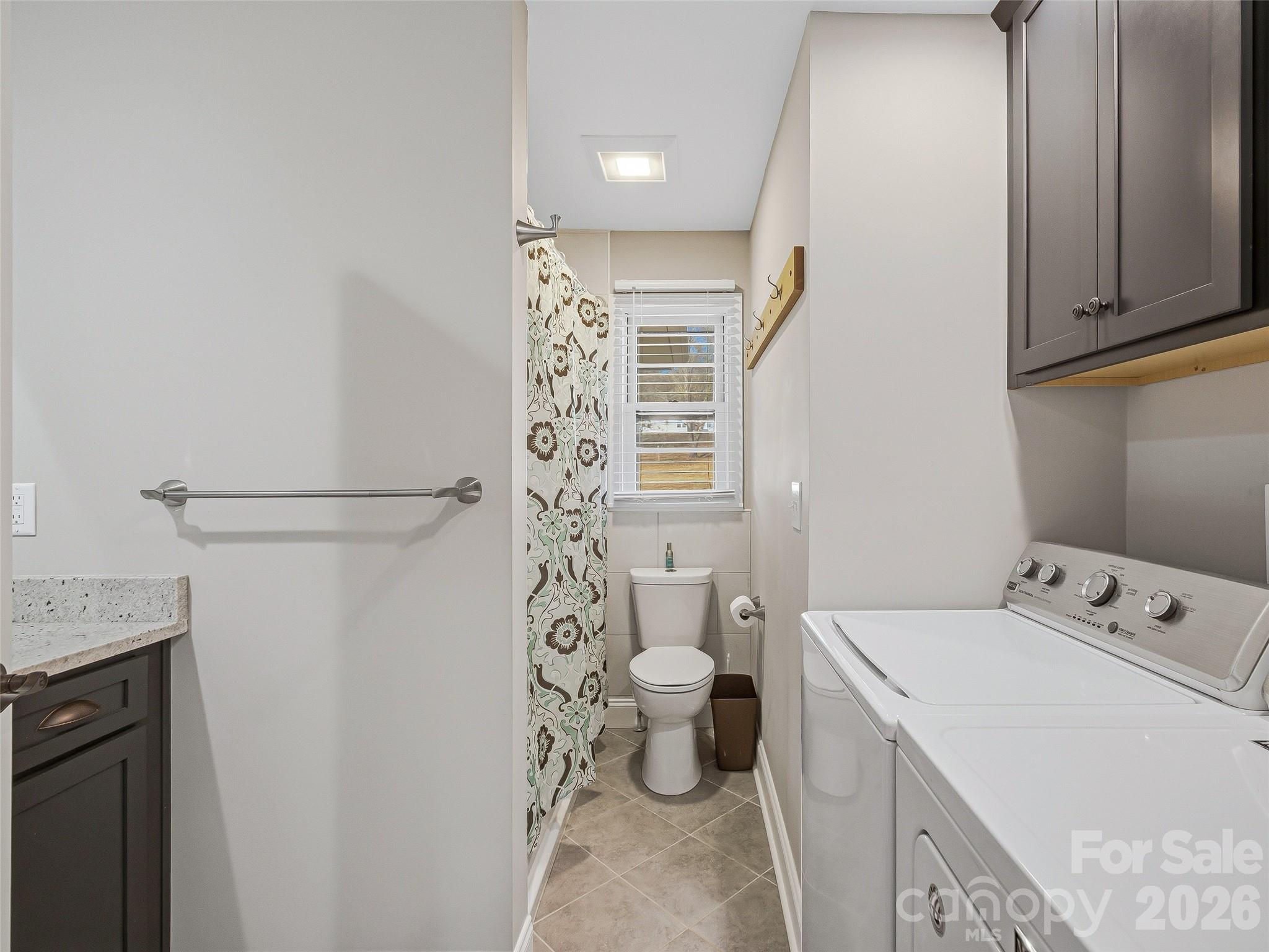3869 Crab Creek Road Penrose, NC 28766 - Photo 16 of 19 a bathroom with a sink a toilet and shower