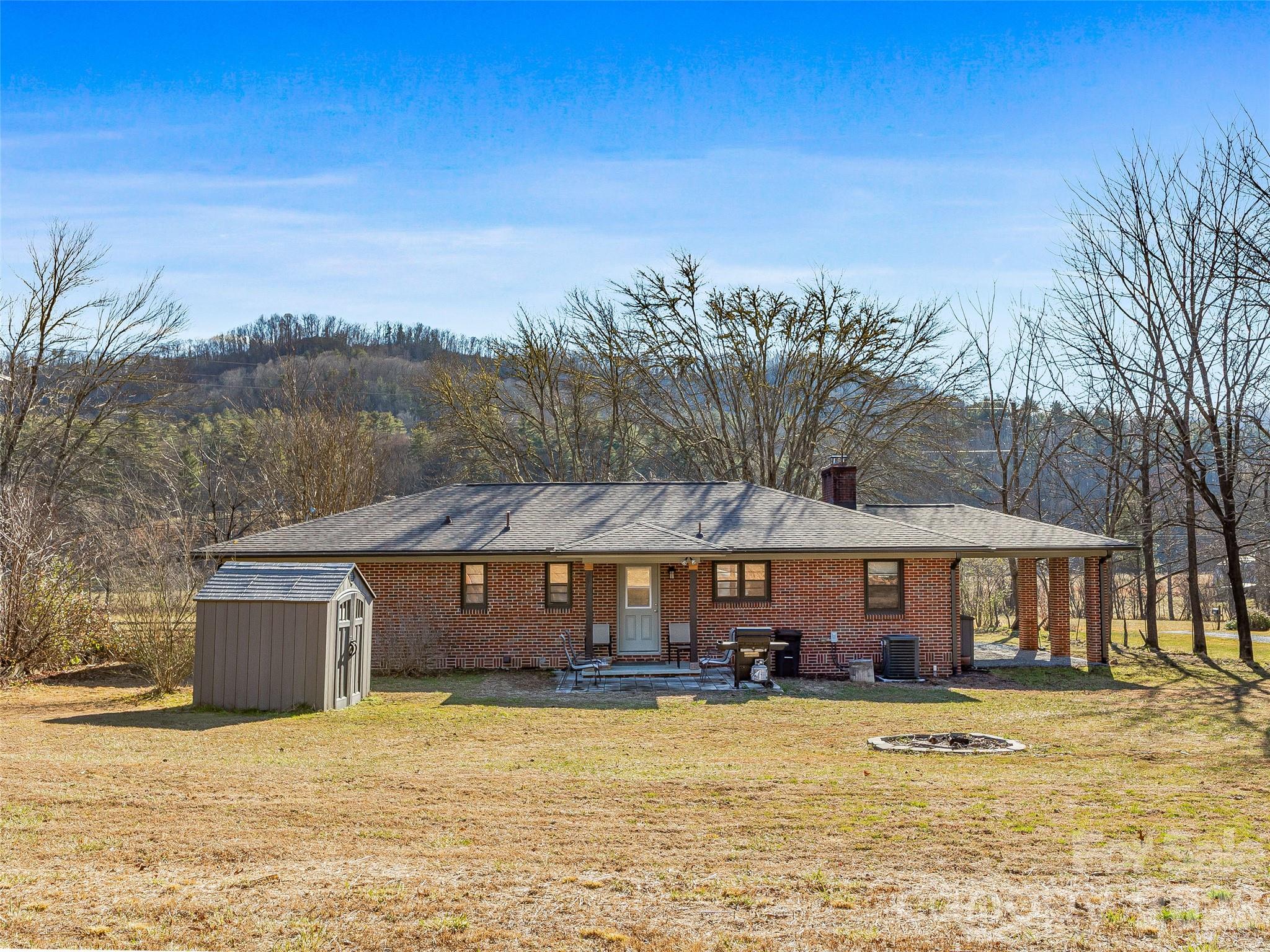3869 Crab Creek Road Penrose, NC 28766 - Photo 19 of 19 a front view of house with yard and seating space