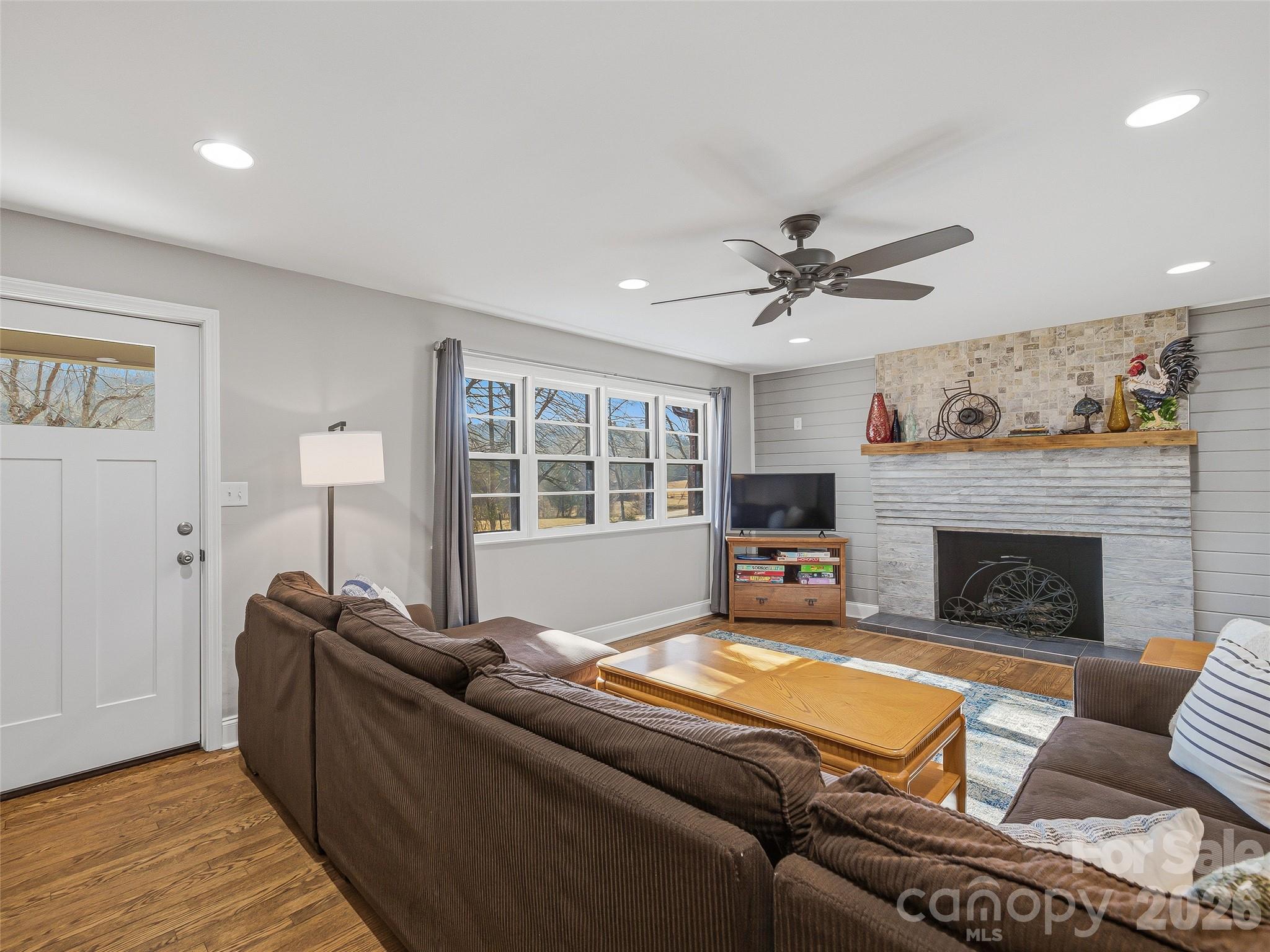 3869 Crab Creek Road Penrose, NC 28766 - Photo 4 of 19 a living room with furniture and a fireplace