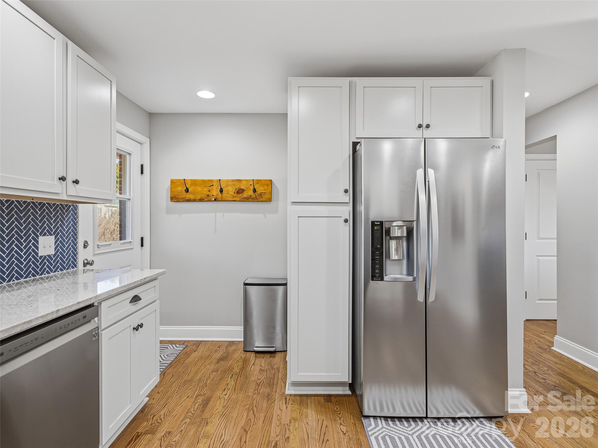 3869 Crab Creek Road Penrose, NC 28766 - Photo 9 of 19 a kitchen with stainless steel appliances granite countertop a refrigerator and a stove top oven