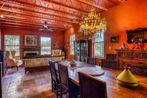 a bed room with furniture and a wooden floor