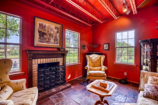 a living room with furniture and a rug