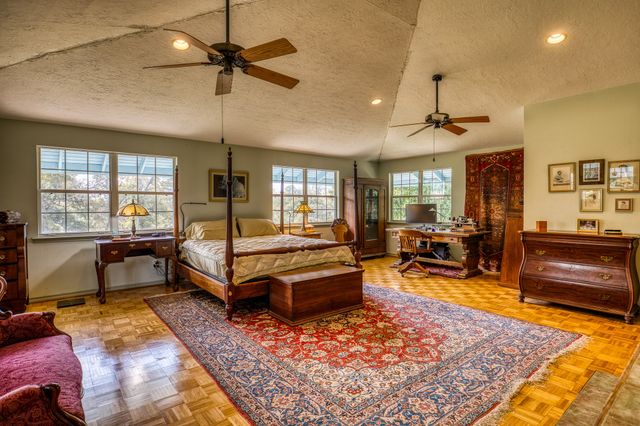 a view of an house with backyard space and garden