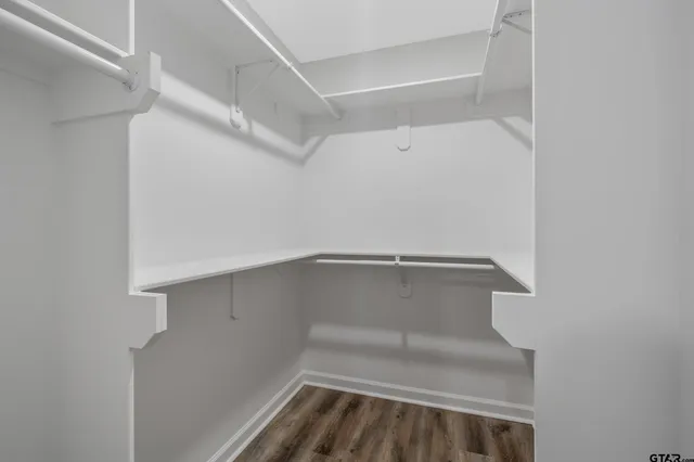 a view of an empty walk in closet