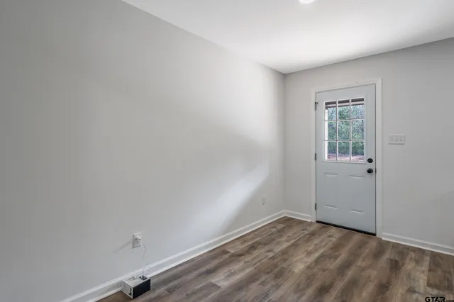 a view of an empty room and window