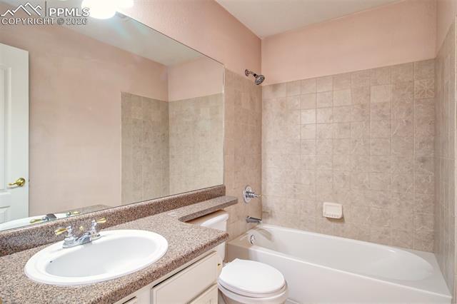 3579 Indigo Ridge Point Colorado Springs, CO 80910 - Photo 15 of 33 Full bathroom between primary bedroom and bedroom 2
