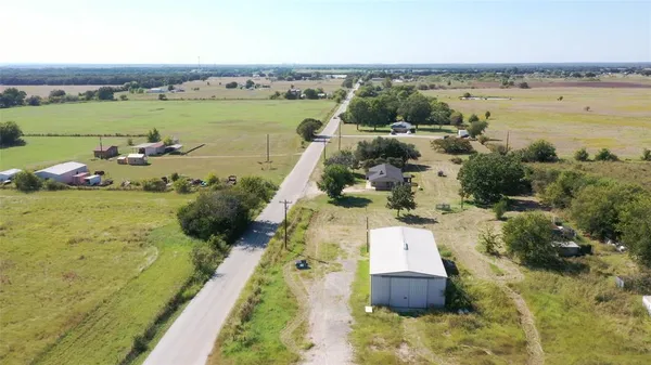 an aerial view of a house with a lake view