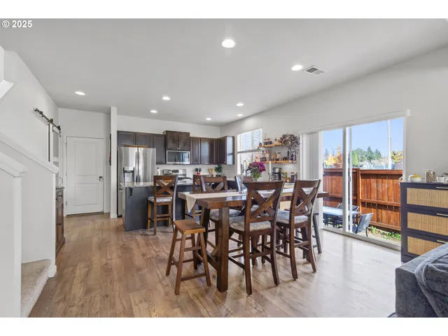 a view of a dining area with furniture window and wooden floor