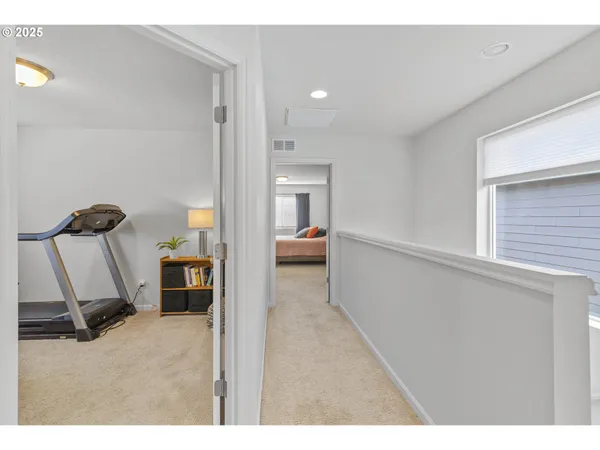 a view of a hallway with workspace
