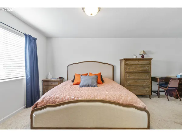 a bedroom with a bed and a closet