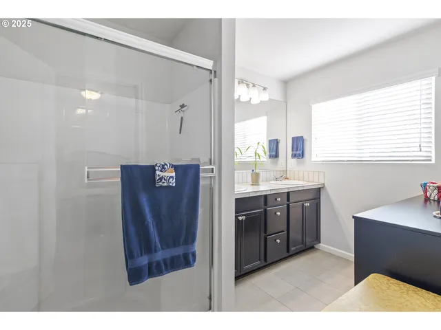 a bathroom with a sink a mirror and a bathtub