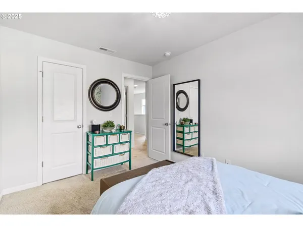 a bedroom with a bed and a table