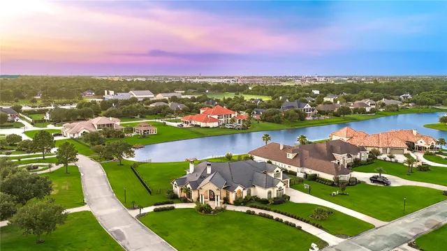 an aerial view of a house with a lake view