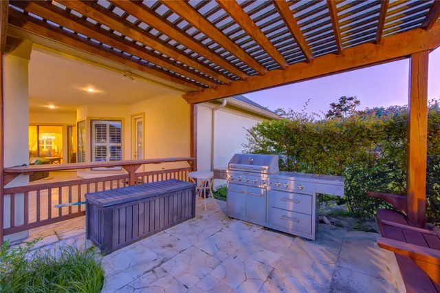 a view of a chairs and a sink in a patio