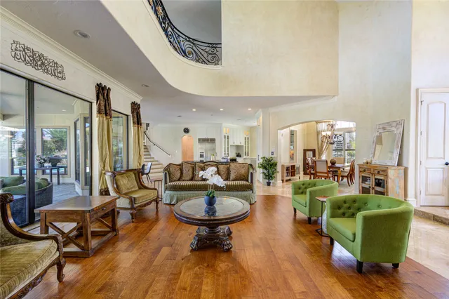 a living room with furniture a rug and a large window