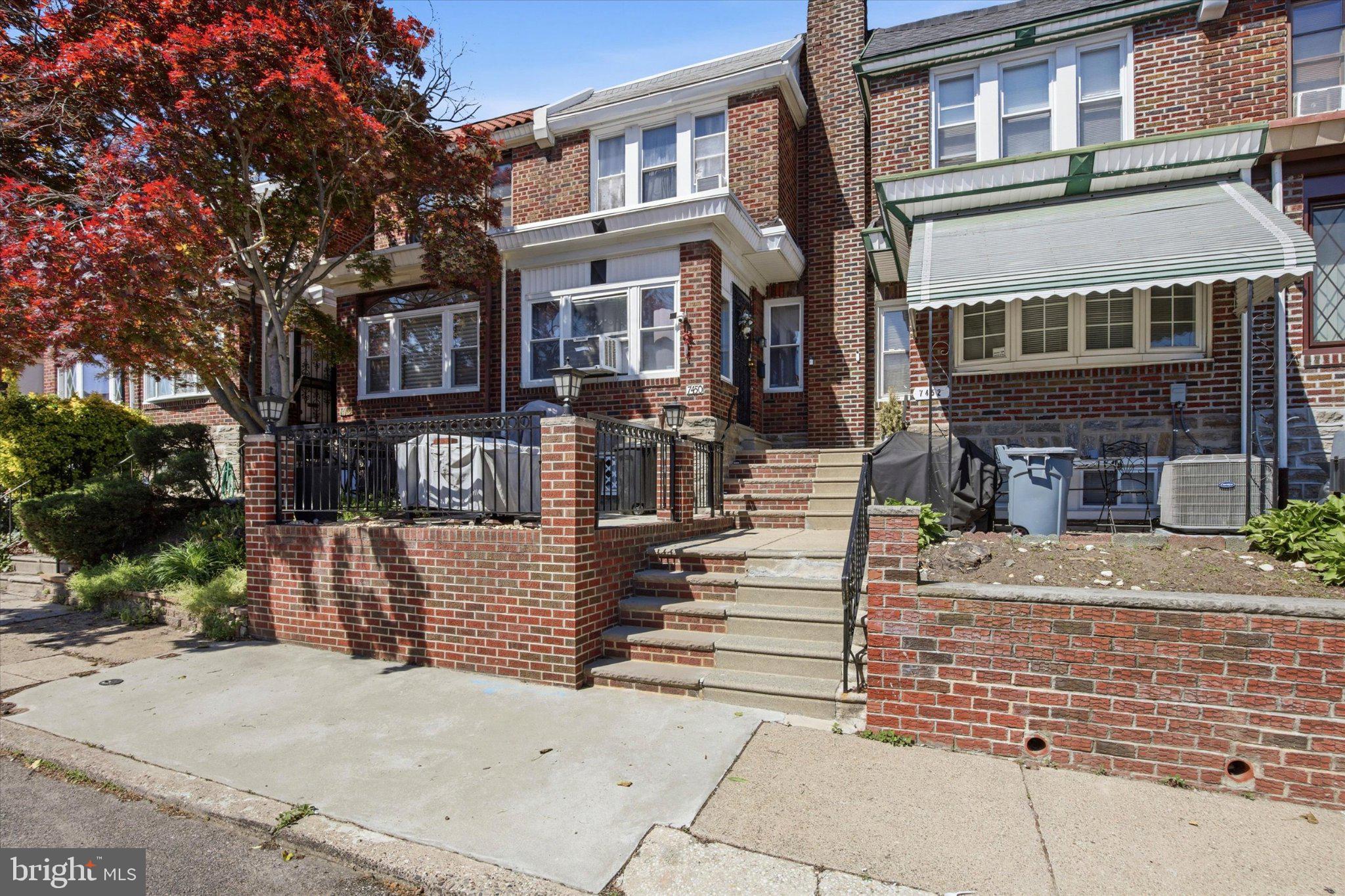 7450 Beverly Road Philadelphia, PA 19138 - Photo 1 of 29 Charming brick facade with vibrant trees.
