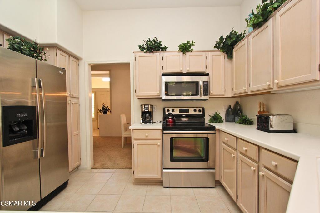78448 Desert Willow Drive Palm Desert, CA 92211 - Photo 14 of 38 a kitchen with cabinets stainless steel appliances and a counter space