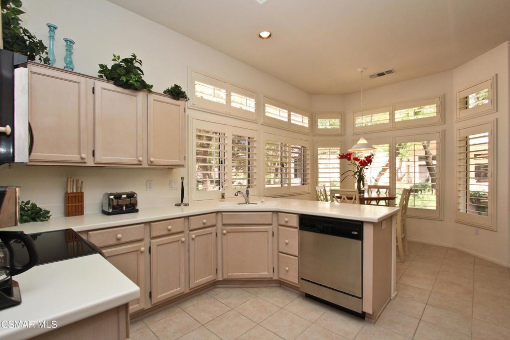 78448 Desert Willow Drive Palm Desert, CA 92211 - Photo 15 of 38 a kitchen with sink and cabinets
