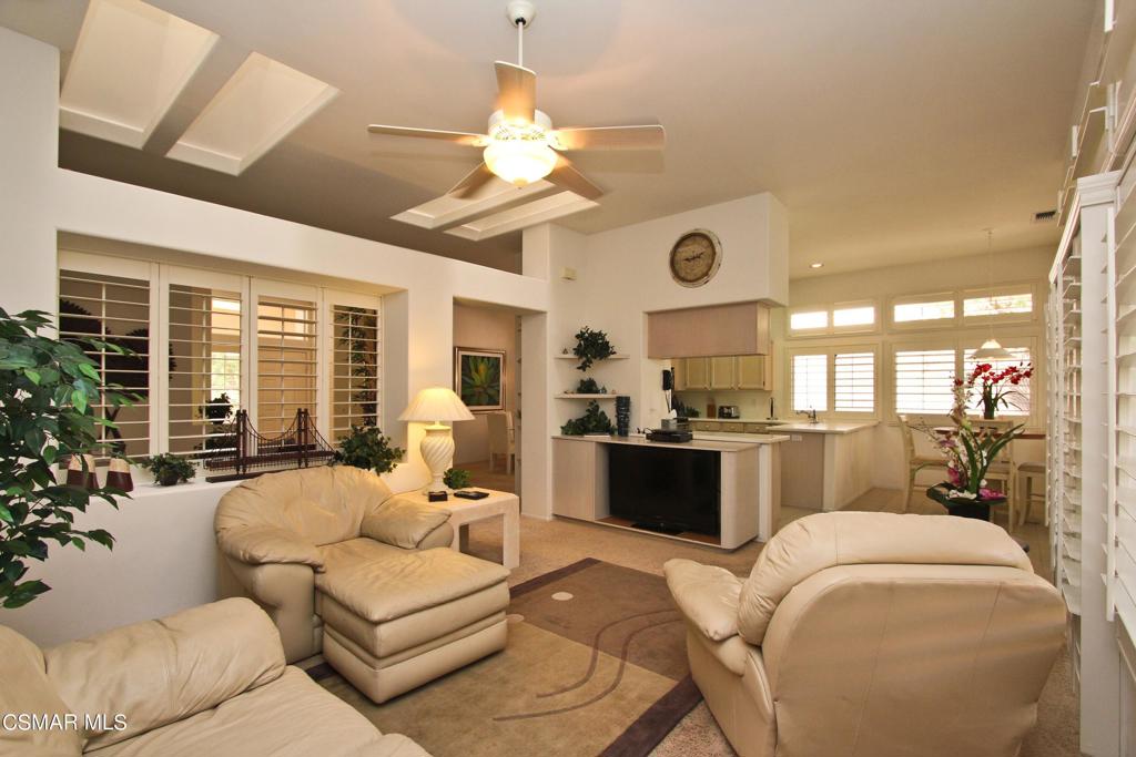 78448 Desert Willow Drive Palm Desert, CA 92211 - Photo 18 of 38 a living room with furniture large window and flat screen tv