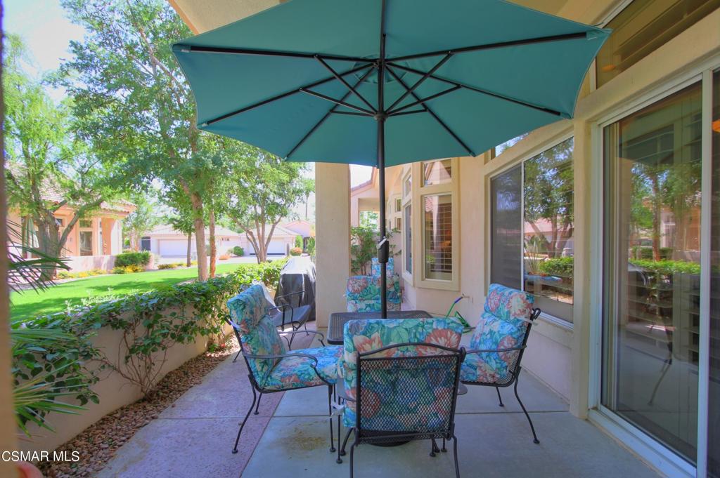 78448 Desert Willow Drive Palm Desert, CA 92211 - Photo 29 of 38 a view of a patio with furniture and backyard