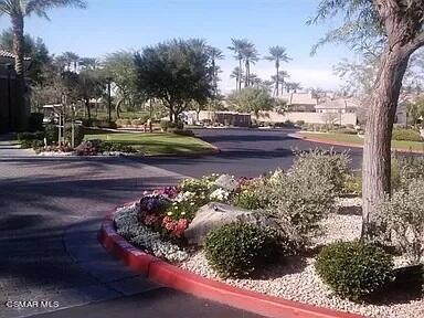 78448 Desert Willow Drive Palm Desert, CA 92211 - Photo 34 of 38 a view of a yard with cars parked