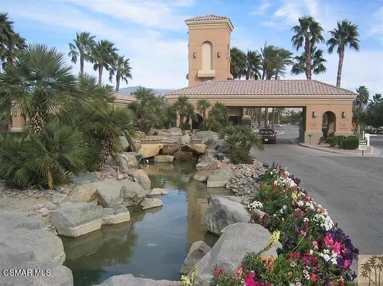 78448 Desert Willow Drive Palm Desert, CA 92211 - Photo 35 of 38 a front view of a house with a yard and mountain view