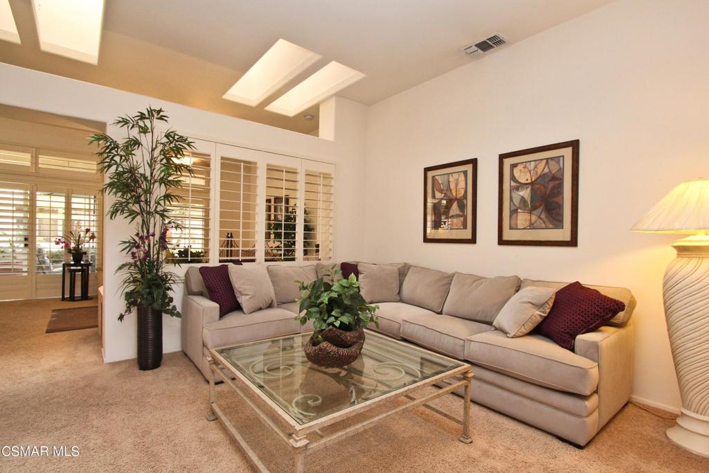 78448 Desert Willow Drive Palm Desert, CA 92211 - Photo 6 of 38 a living room with furniture and a large window