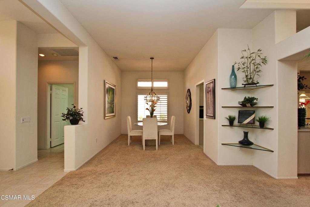 78448 Desert Willow Drive Palm Desert, CA 92211 - Photo 9 of 38 wooden floor in kitchen and an empty room