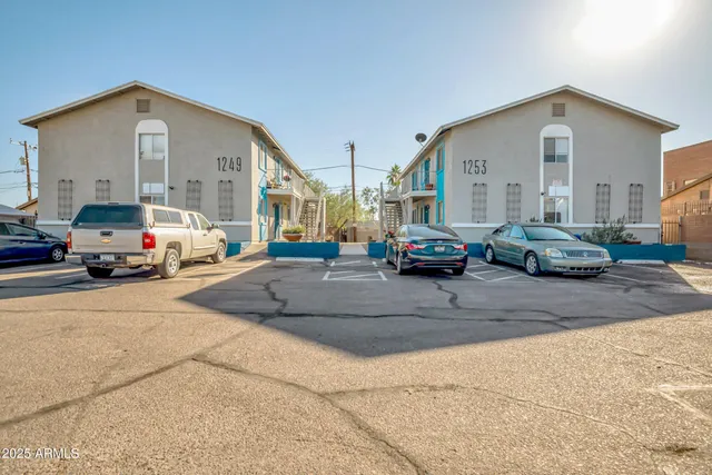 a view of cars parked in front of a building